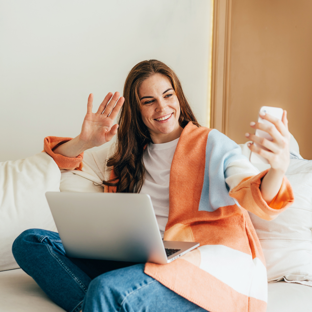 senior living sales woman holding up phone and taking video of herself speaking